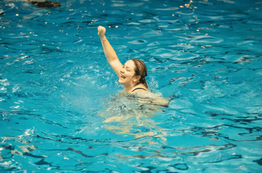 Swimmer celevrating in pool Swimmer celebrating in Den Haag pool.